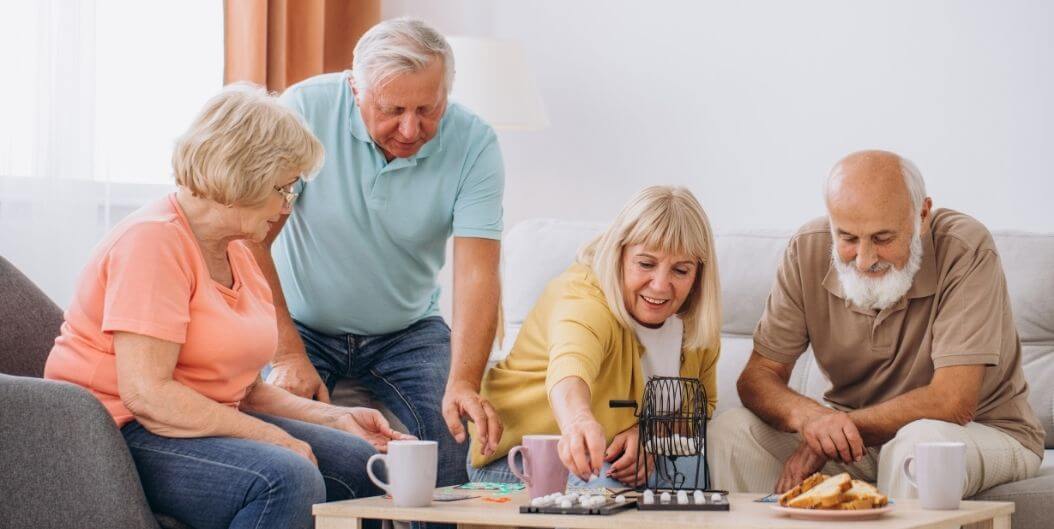 Group of Seniors Playing Bingo in Memory Care Facility