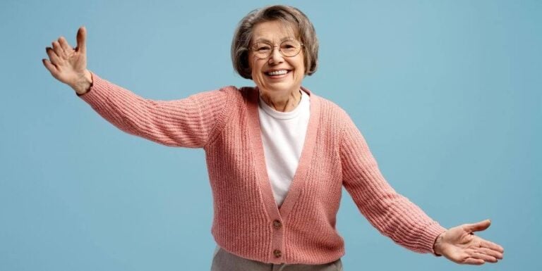 Smiling Elderly Woman Reaching Out for Hug in Assisted Living Facility